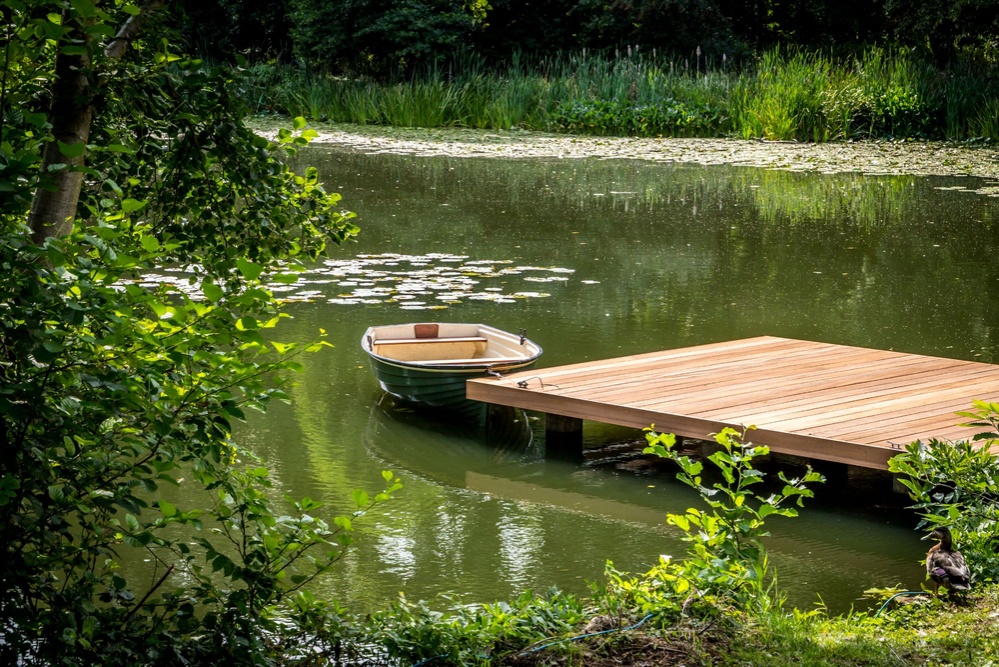 Smooth Yellow Balau timber, positioned closer to the water for easy rowing boat mooring
